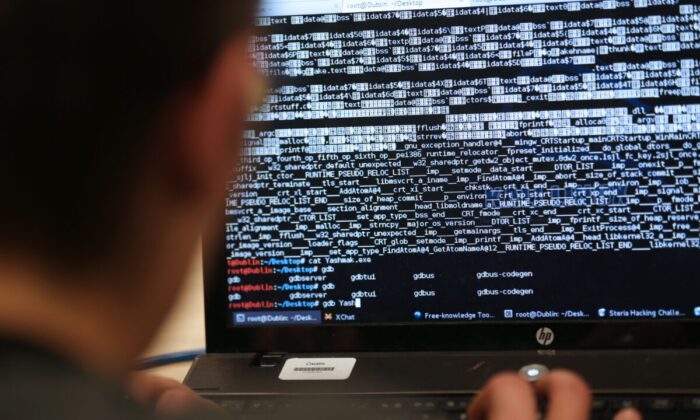 An engineering student takes part in a hacking challenge near Paris on March 16, 2013. (AFP via Getty Images/Thomas Samson)