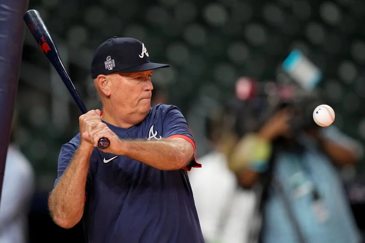 Atlanta Braves manager Brian Snitker hits during batting practice in Houston, in preparation for Game 1 of baseball's World Series tomorrow against the Houston Astros, on Oct. 25, 2021. (David J. Phillip/AP Photo)