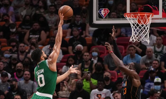 Boston Celtics forward Jayson Tatum (0) shoots the ball against Miami Heat center Bam Adebayo (13) during the first half at FTX Arena in Miami, Fla., USA, Nov 4, 2021. (Jasen Vinlove-USA TODAY Sports Via Field Level Media)