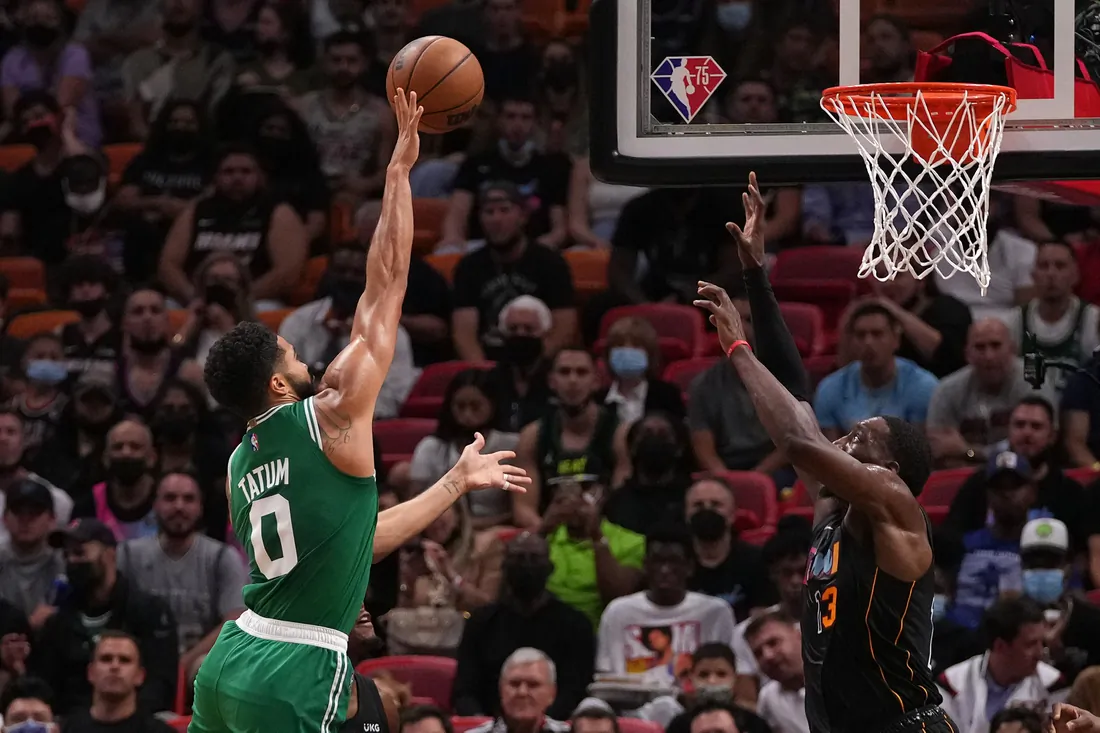 Boston Celtics forward Jayson Tatum (0) shoots the ball against Miami Heat center Bam Adebayo (13) during the first half at FTX Arena in Miami, Fla., USA, Nov 4, 2021. (Jasen Vinlove-USA TODAY Sports Via Field Level Media)
