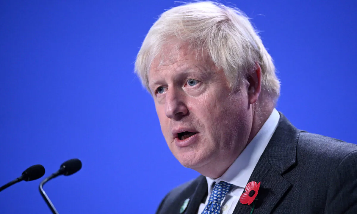 Britain's Prime Minister Boris Johnson speaks during a press conference at the COP26 U.N. Climate Change Conference in Glasgow, Scotland, on Nov. 2, 2021. (Oli Scarff/AFP via Getty Images)