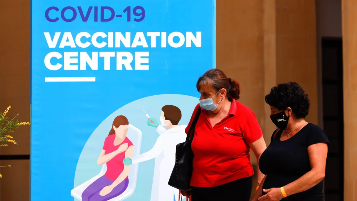 People walk outside a vaccination centre at the University of Malta in Msida, on May 24, 2021. (Darrin/Reuters)