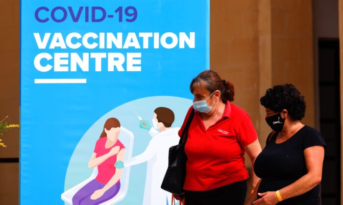 People walk outside a vaccination centre at the University of Malta in Msida, on May 24, 2021. (Darrin/Reuters)