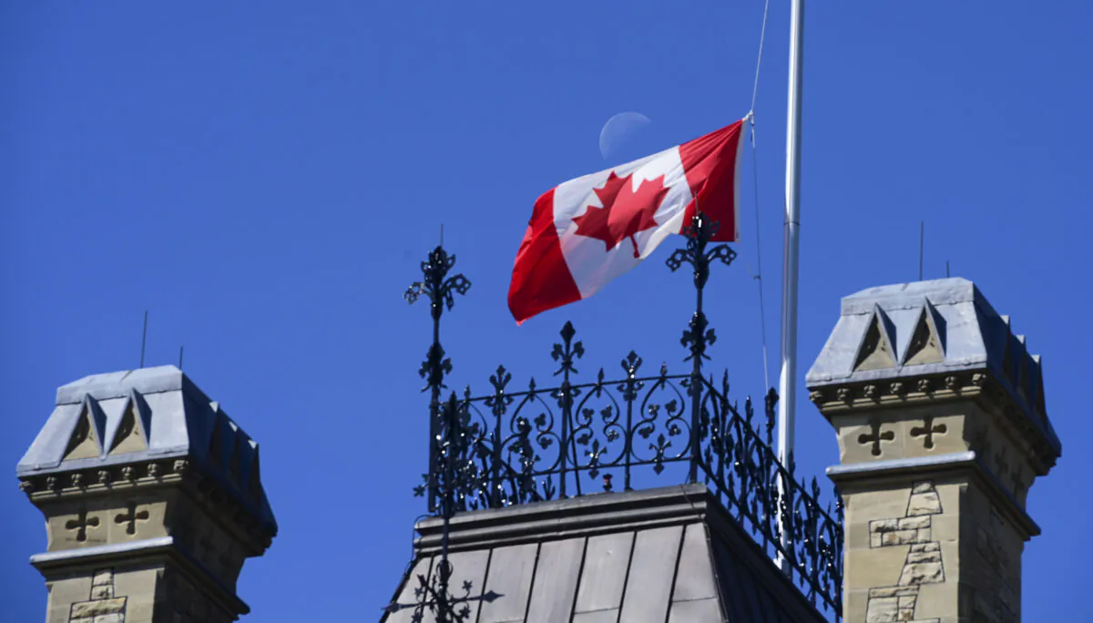 The Canadian flag flies at half-mast in recognition of residential school students, on the West Block of Parliament Hill in Ottawa on June 2, 2021. (The Canadian Press/Sean Kilpatrick)