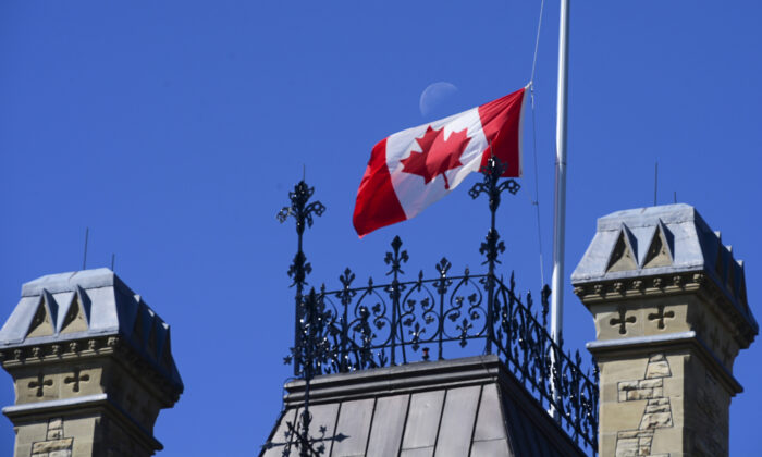  Canadian flag flies at half-mast on the West Block of Parliament Hill in Ottawa on June 2, 2021. ( Canadian Press/Sean Kilpatrick)