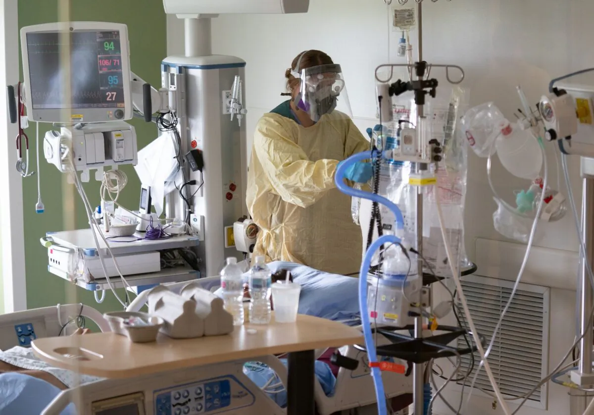 A nurse works in the COVID-19 Intensive Care Unit at Surrey Memorial Hospital in Surrey, B.C., on June 4, 2021. (The Canadian Press/Jonathan Hayward)