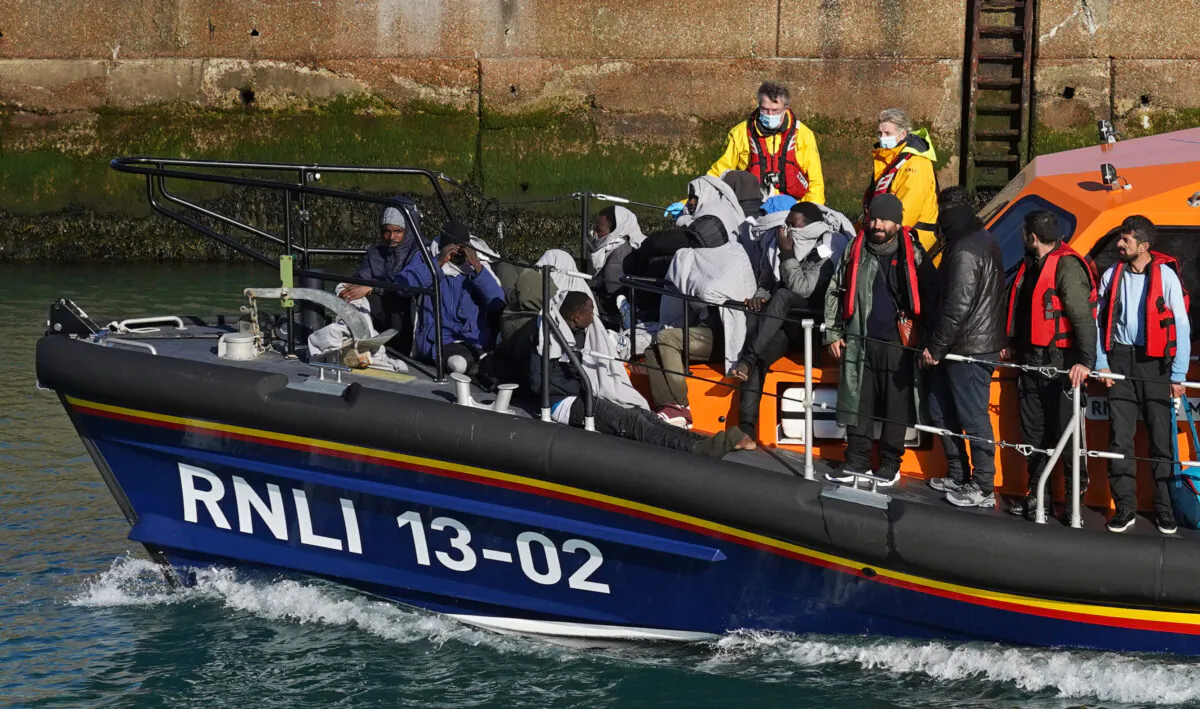 A group of people thought to be illegal immigrants are brought in to Dover, Kent, onboard the Dungeness Lifeboat following a small boat incident in the Channel on Nov. 3, 2021. (Gareth Fuller/PA)
