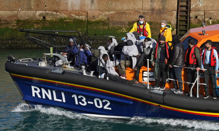 A radical  of radical   thought   to beryllium  migrants are brought successful  to Dover, Kent, onboard the Dungeness Lifeboat pursuing  a tiny  vessel  incidental  successful  the Channel connected  Nov. 3, 2021. (Gareth Fuller/PA)