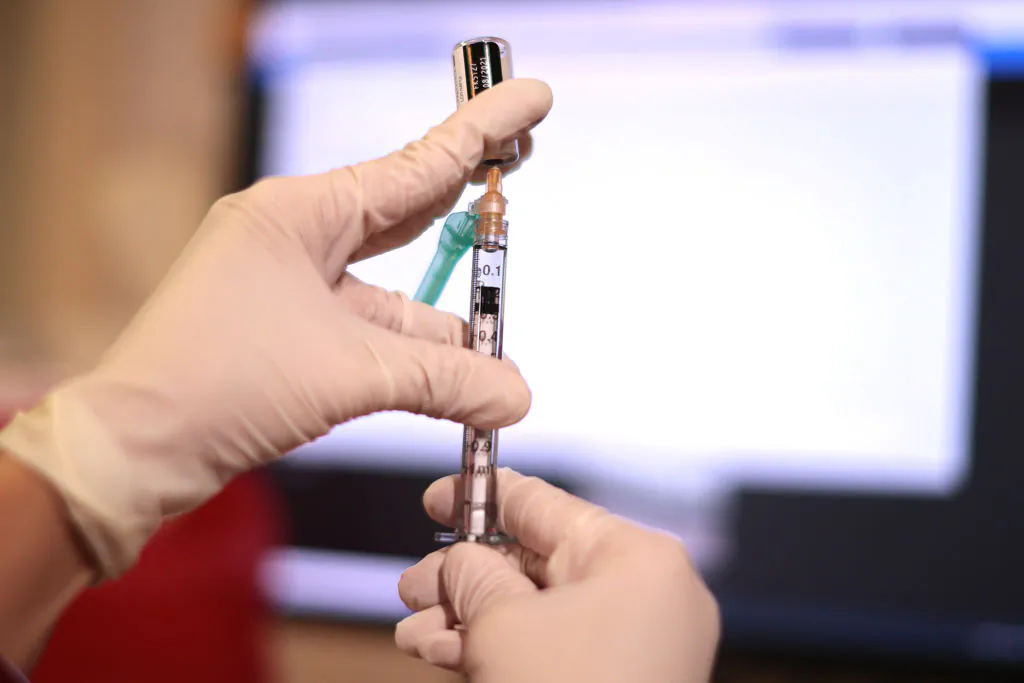 A pharmacist prepares a dose of the COVID-19 vaccine in Annandale, Virginia on November 04, 2021. (Chip Somodevilla/Getty Images)
