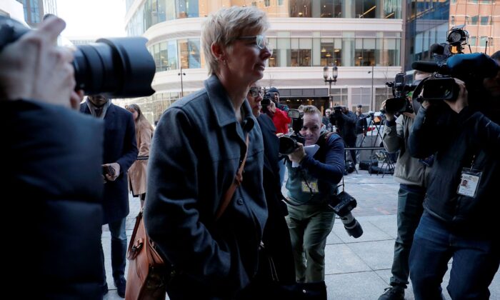 Donna Heinel, erstwhile  subordinate  diversion  manager  astatine  the University of Southern California (USC), arrives astatine  the national  courthouse successful  Boston, Mass., connected  March 25, 2019. (Brian Snyder/Reuters)
