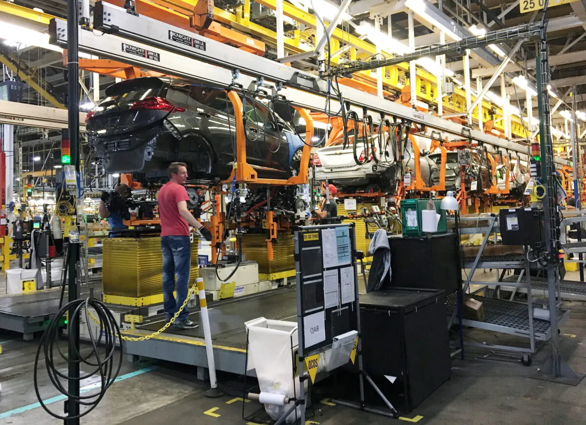 Workers assemble Chevy Bolt EV cars at the General Motors assembly plant in Orion Township, Mich., on Nov. 4, 2016. (Joe White/Reuters)