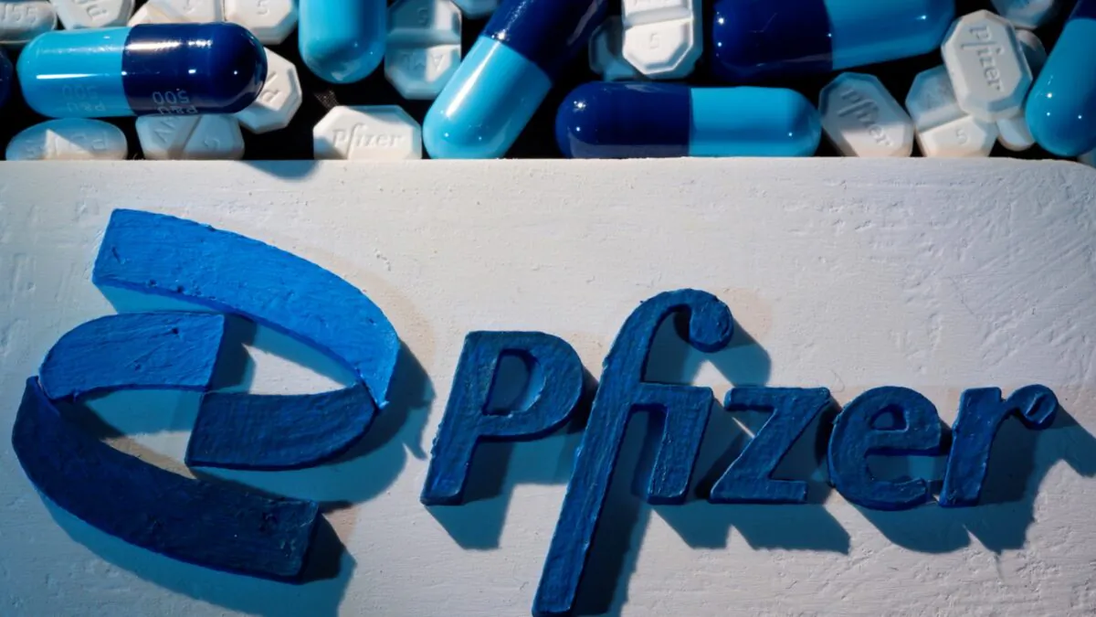 A 3D printed Pfizer logo is placed near medicines from the same manufacturer in this illustration taken on Sept. 29, 2021. (Dado Ruvic/Reuters)