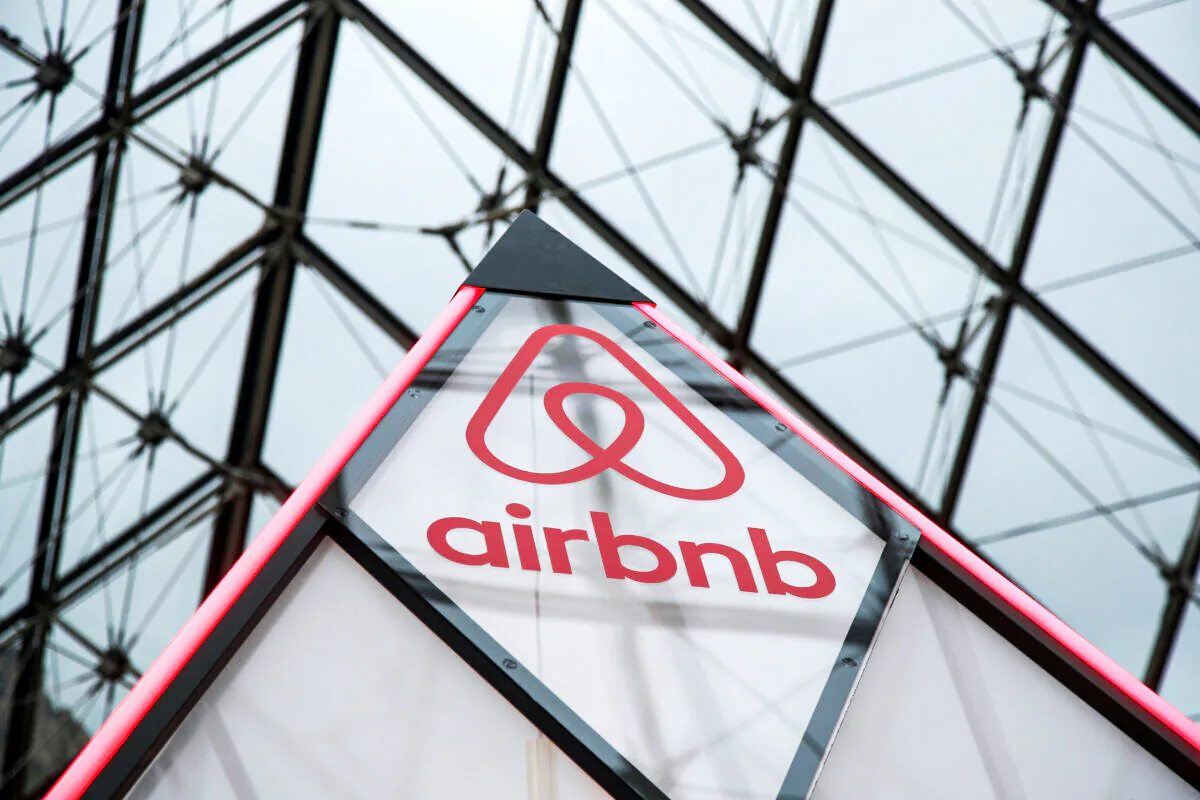 The Airbnb logo on a mini pyramid under the glass Pyramid of the Louvre museum in Paris, France, on March 12, 2019. (Charles Platiau/Reuters)