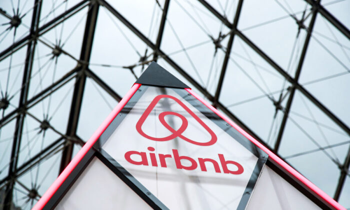 The Airbnb logo on a mini pyramid under the glass Pyramid of the Louvre museum in Paris, France, on March 12, 2019. (Charles Platiau/Reuters)