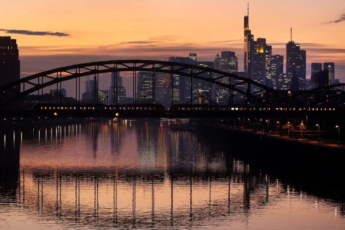  A commuter train passes by the skyline with its financial district ahead of the European Central Banks (ECB) governing council meeting later this week in Frankfurt, Germany, on Oct. 25, 2021. (Kai Pfaffenbach/Reuters)