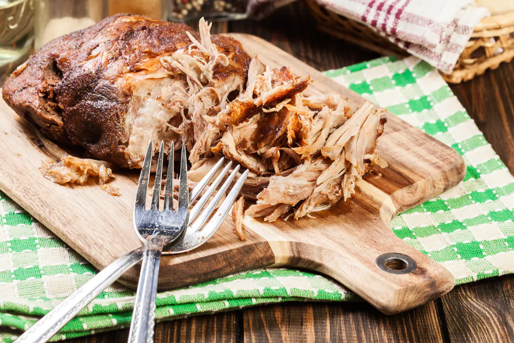 Range porketta is made from a cheaper cut of meat, such as pork butt or shoulder, rubbed with fennel and garlic and slow-roasted until fork-tender. (Slawomir Fajer/Shutterstock)
