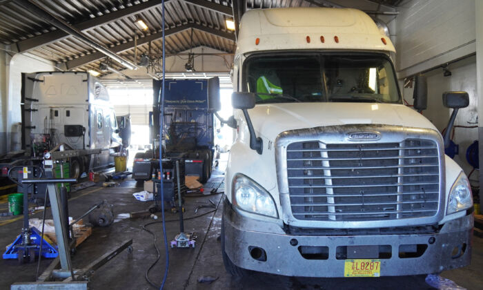 A Freightliner semi truck waits to be repaired at Rocky Mountain Truck Centers in Flagstaff, Ariz., on Nov. 1, 2021. (Allan Stein/The Epoch Times)
