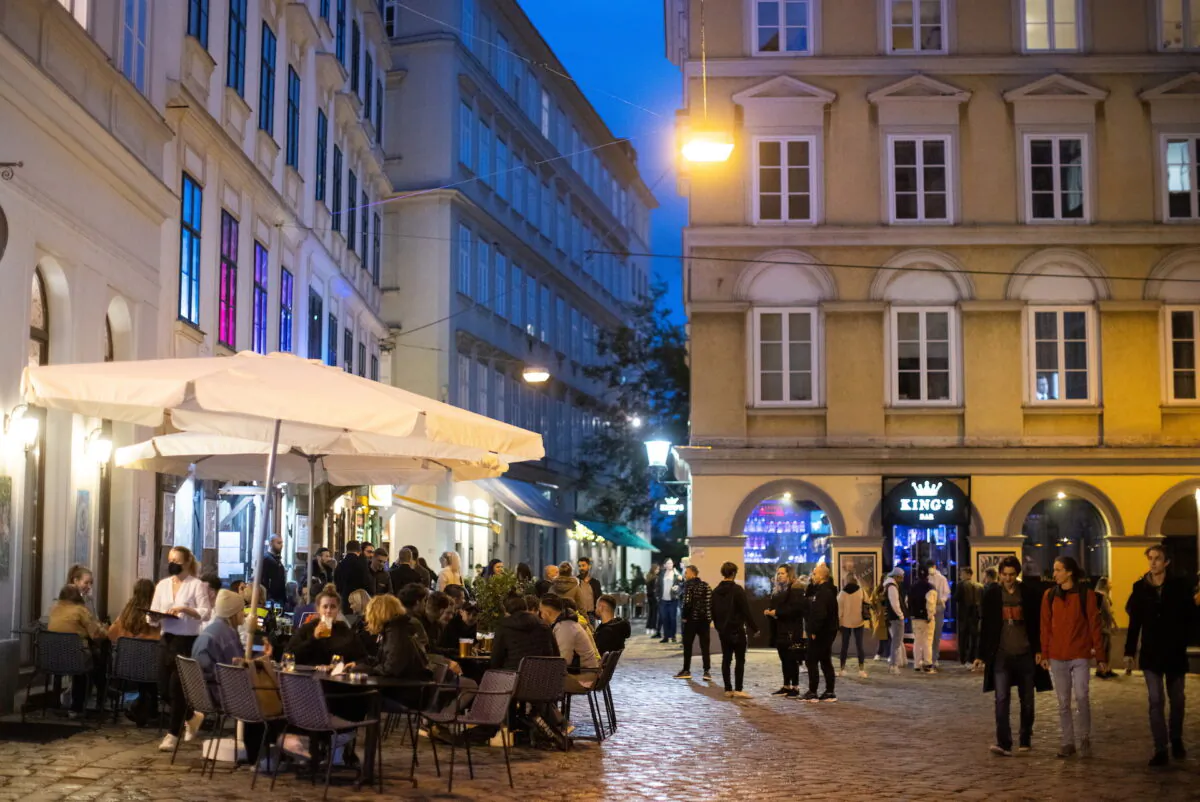 People enjoy an evening drink at Bermuda Triangle as cafes, bars and restaurants reopen after closing down for months amid the coronavirus disease (COVID-19) outbreak in Vienna, Austria, May 19, 2021. (Lisi Niesner/Reuters)