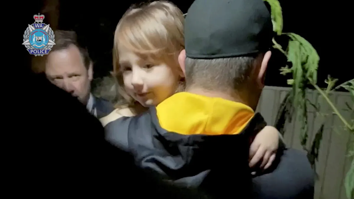 Bodycam footage shows a security officer carrying 4-year-old Cleo Smith, who went missing from an Australian outback campsite more than two weeks ago and was found in a locked house on Nov. 3, as she is being rescued, in Carnarvon, Australia, on Nov. 3, 2021. (Western Australia Police Force/Handout via Reuters)