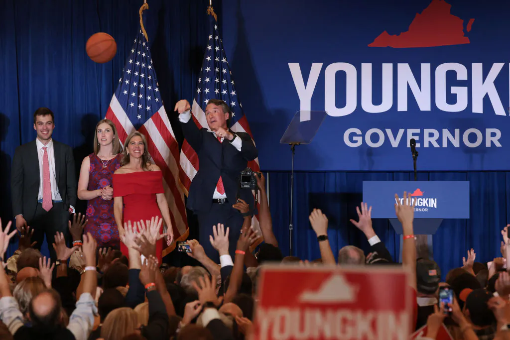 Virginia Republican gubernatorial candidate Glenn Youngkin shoots an autographed basketball into the crowd with his family at an election-night rally at the Westfields Marriott Washington Dulles in Chantilly, Va., on Nov. 2, 2021. (Chip Somodevilla/Getty Images)