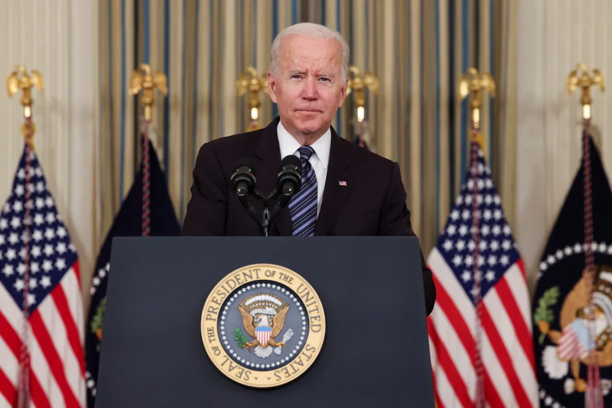 President Joe Biden looks on as he delivers remarks on the October jobs report at the White House in Washington, on Nov. 5, 2021. (Evelyn Hockstein/Reuters)