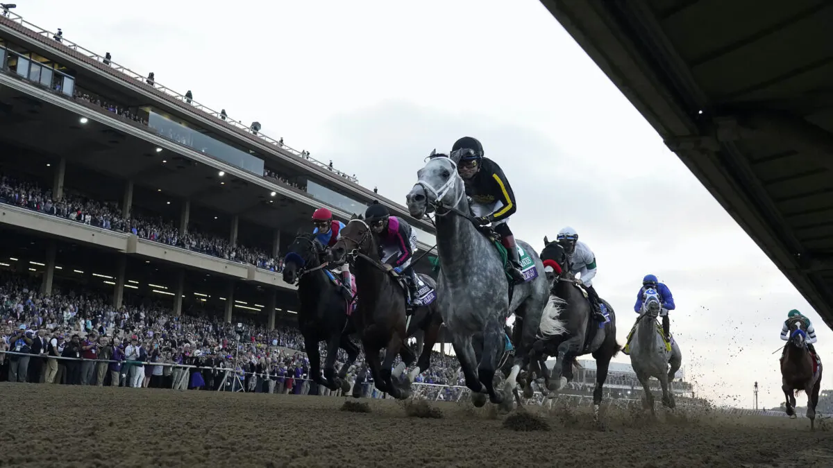 Joel Rosario rides Knicks Go, foreground, to victory during the Breeders' Cup Classic race at the Del Mar racetrack in Del Mar, Calif., on Nov. 6, 2021. (Gregory Bull/AP Photo)
