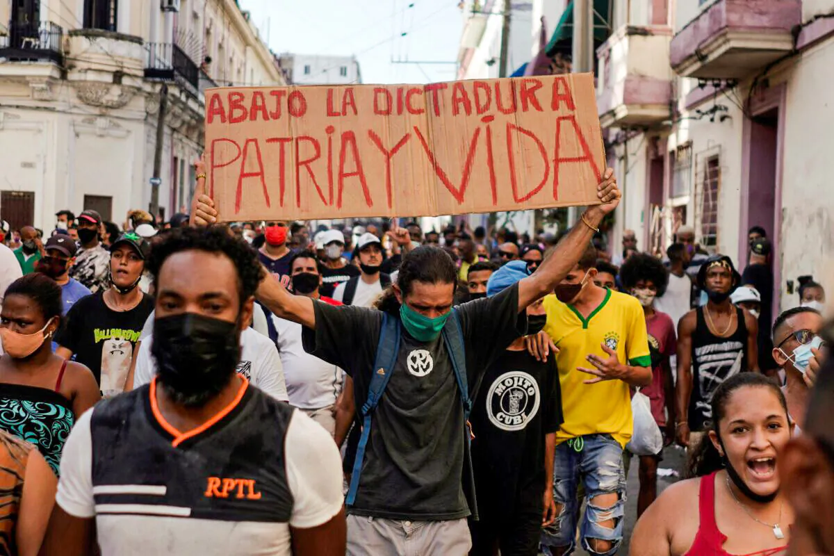 People shout slogans against the communist regime during a protest in Havana, Cuba, on July 11, 2021. (Alexandre Meneghini/Reuters)