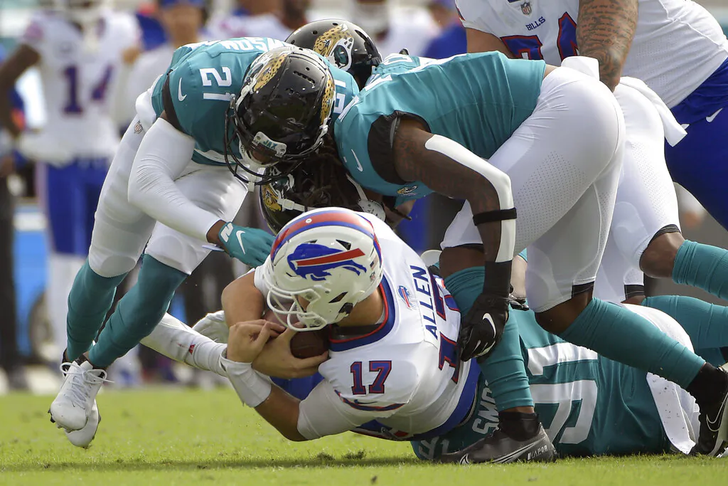 Buffalo Bills quarterback Josh Allen (17) is sacked by the Jacksonville Jaguars defense during the first half of an NFL football game in Jacksonville, Fla., on Nov. 7, 2021. (Phelan M. Ebenhack/AP Photo)