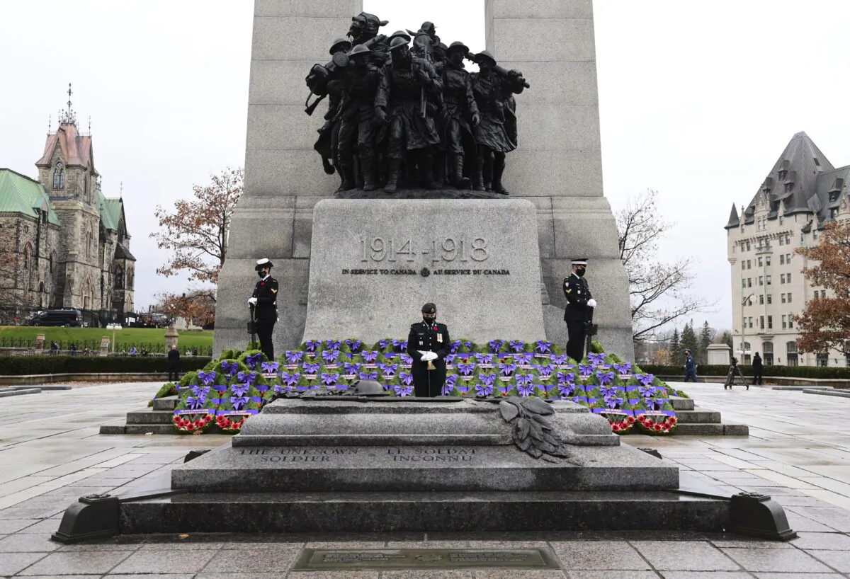 Sentinels stand guard during the Remembrance Day ceremony at the National War Memorial in Ottawa on Nov. 11, 2020. (The Canadian Press/Sean Kilpatrick)