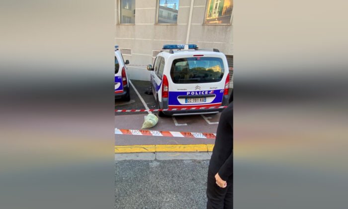 Police cars are reportedly seen at a police station injured after being stabbed with a knife in Cannes, France, on November 8, 2021.  (Twitter / ECiotti / via Reuters)