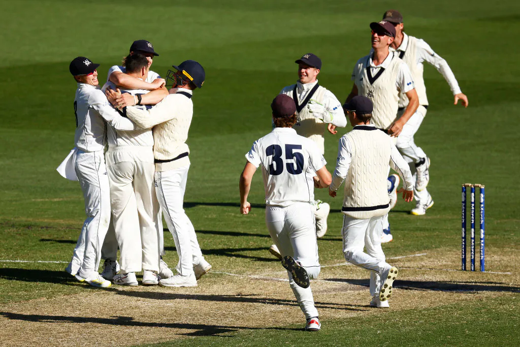 Victoria celebrate victory after Scott Boland of Victoria takes the final wicket by dismissing Trent Copeland of New South Wales during day four of the Sheffield Shield match between New South Wales and Victoria at Melbourne Cricket Ground, in Melbourne, Australia, on Nov. 08, 2021, (Daniel Pockett/Getty Images)
