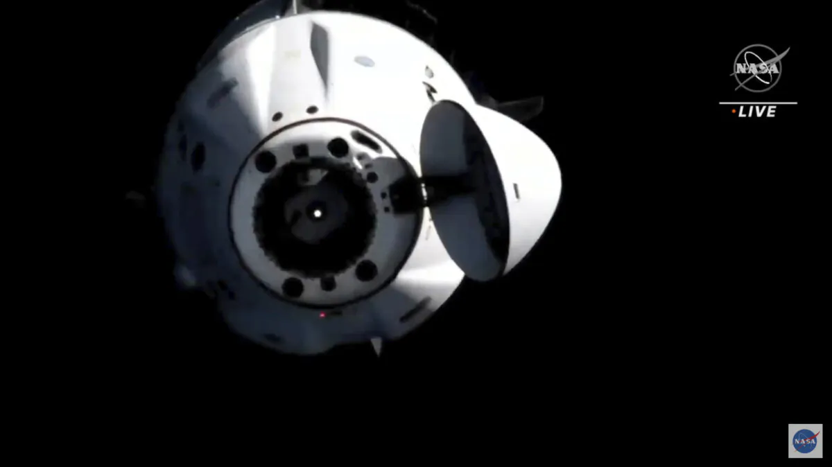 In this image from video provided by NASA, astronauts in the SpaceX Dragon capsule undock from the International Space Station on Nov. 8, 2021, (NASA via AP)