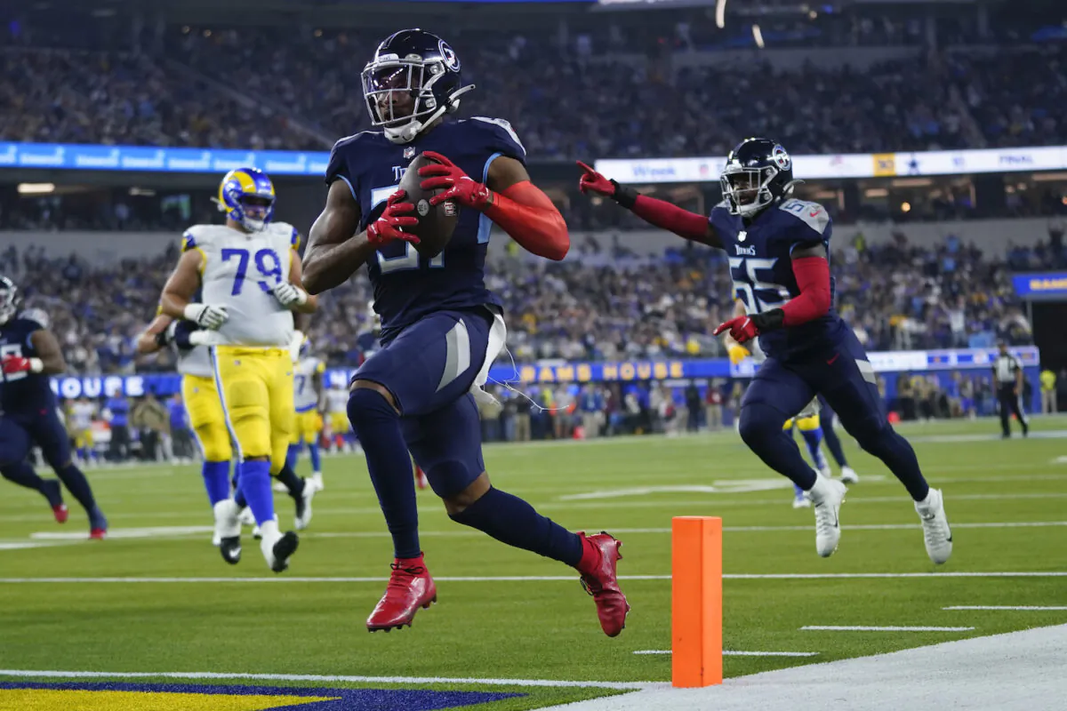 Tennessee Titans free safety Kevin Byard scores a touchdown after grabbing an interception during the first half of an NFL football game against the Los Angeles Rams in Inglewood, Calif., on Nov. 7, 2021. (AP Photo/Ashley Landis)
