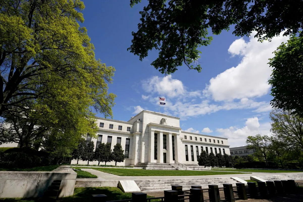 The Federal Reserve building is set against a blue sky in Washington on May 1, 2020. (Kevin Lamarque/Reuters File Photo)