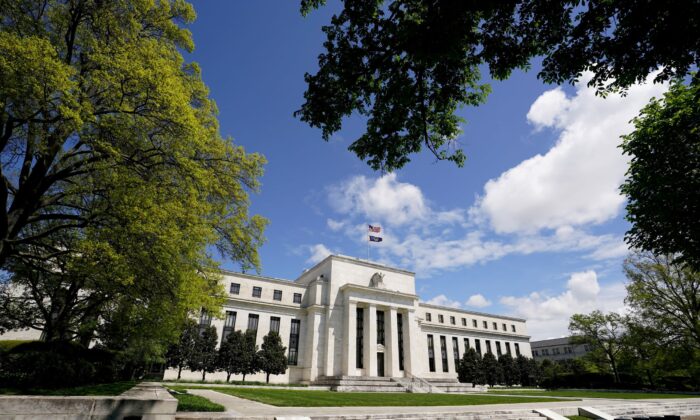 The Federal Reserve building is set against a blue sky in Washington, D.C., on May 1, 2020. (Kevin Lamarque/Reuters)
