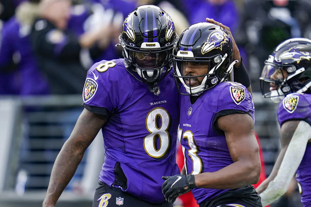 Baltimore Ravens quarterback Lamar Jackson (8) and wide receiver Devin Duvernay (13) celebrate after connecting for a touchdown during the second half of an NFL football game against the Minnesota Vikings in Baltimore, on Nov. 7, 2021.(Nick Wass/AP Photo)