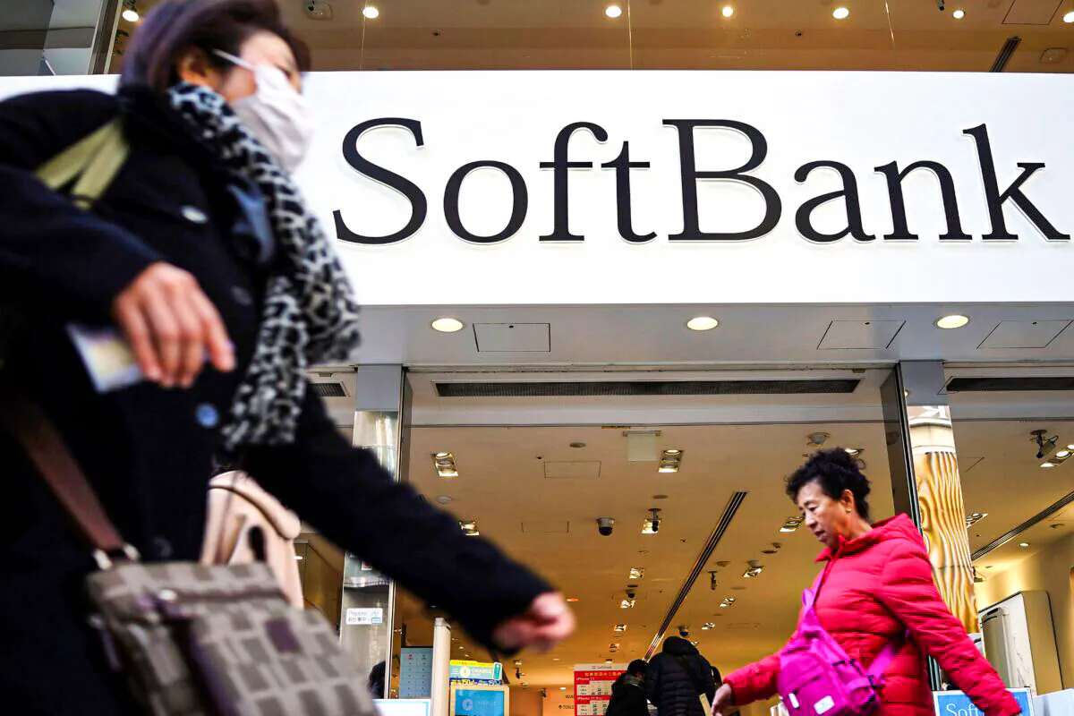 People walk in front of SoftBank store in Ginza shopping district in Tokyo on Jan. 20, 2020. (Eugene Hoshiko/AP Photo)