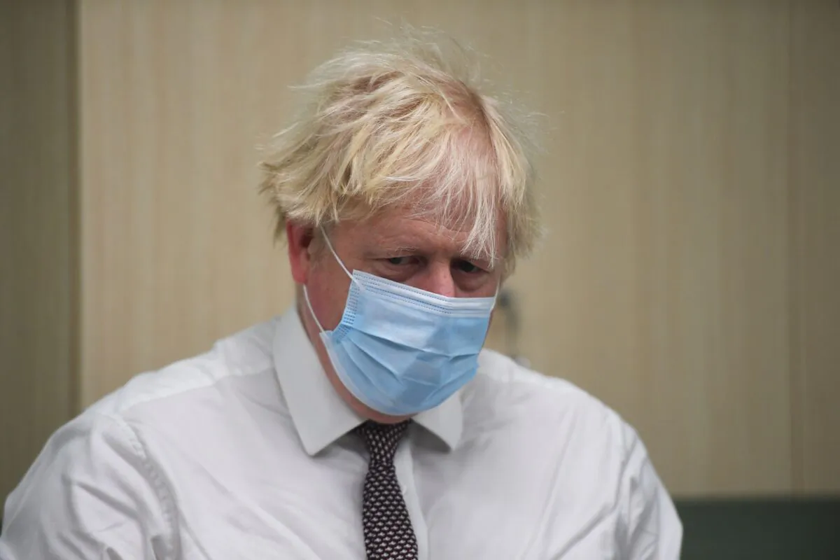 Britain's Prime Minister Boris Johnson is shown around a CT scan room during a visit to a hospital in Hexham in northern England, on Nov. 8, 2021. (Peter Summers/Pool/AFP via Getty Images)