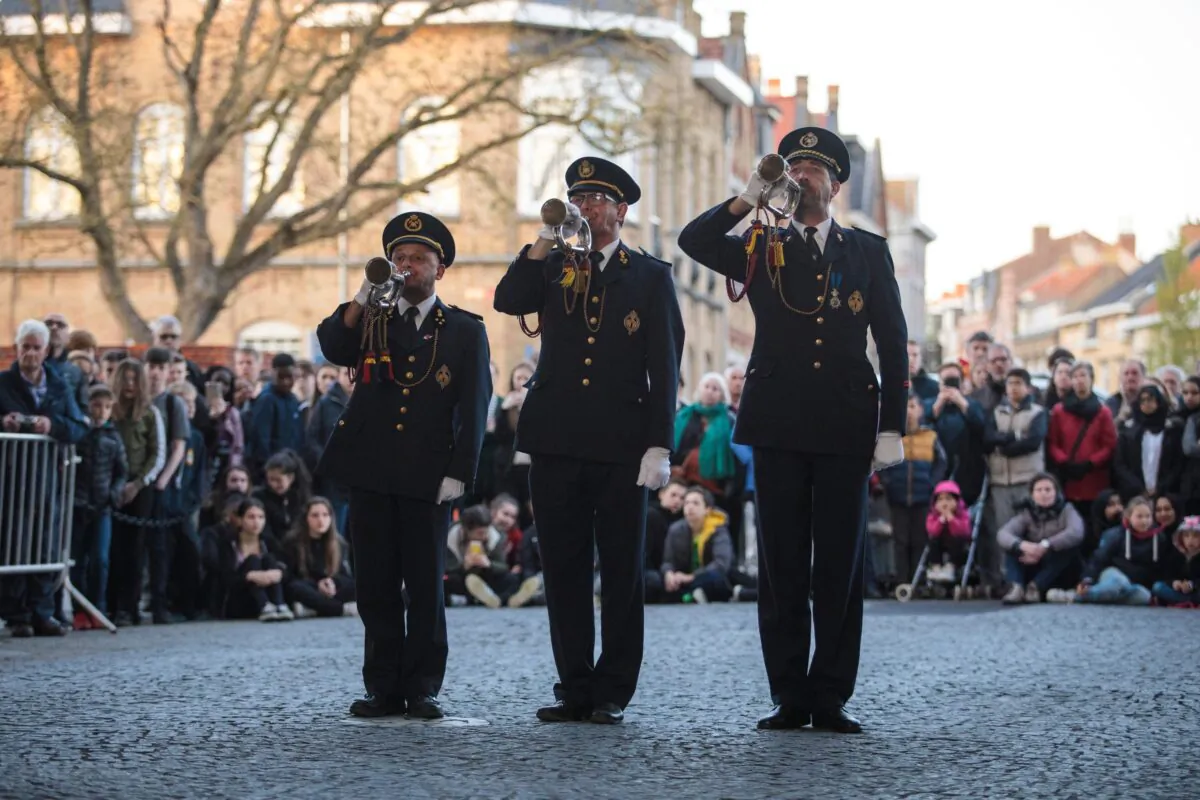 Military band members play the Last Post at the Menin Gate Memorial to the Missing as visitors watch, in Ypres, Belgium, on April 6, 2017, during a ceremony marking the 100th anniversary of the Battle of Vimy Ridge. (Jack Taylor/Getty Images)