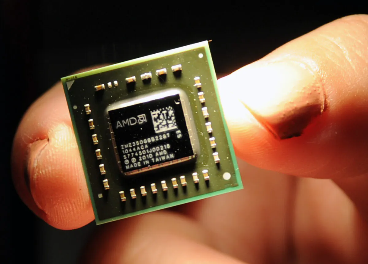 A chip the size of a coin, used in central processing units and graphic processing units developed by the U.S.-headquartered Advanced Micro Devices (AMD) is displayed during a press conference held in Taipei, Taiwan, on May 24, 2011. (Sam Yeh/AFP via Getty Images)