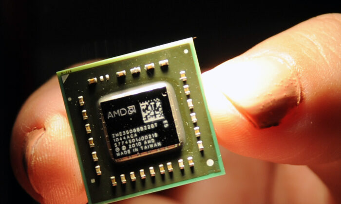 A chip the size of a coin, used in central processing units and graphic processing units developed by the U.S.-headquartered Advanced Micro Devices (AMD) is displayed during a press conference held in Taipei, Taiwan, on May 24, 2011. (Sam Yeh/AFP via Getty Images)