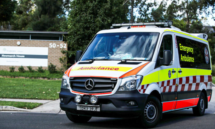 An New South Wales ambulance leaves Newmarch House with a patient on May 01, 2020 in Sydney, Australia. (Cameron Spencer/Getty Images)