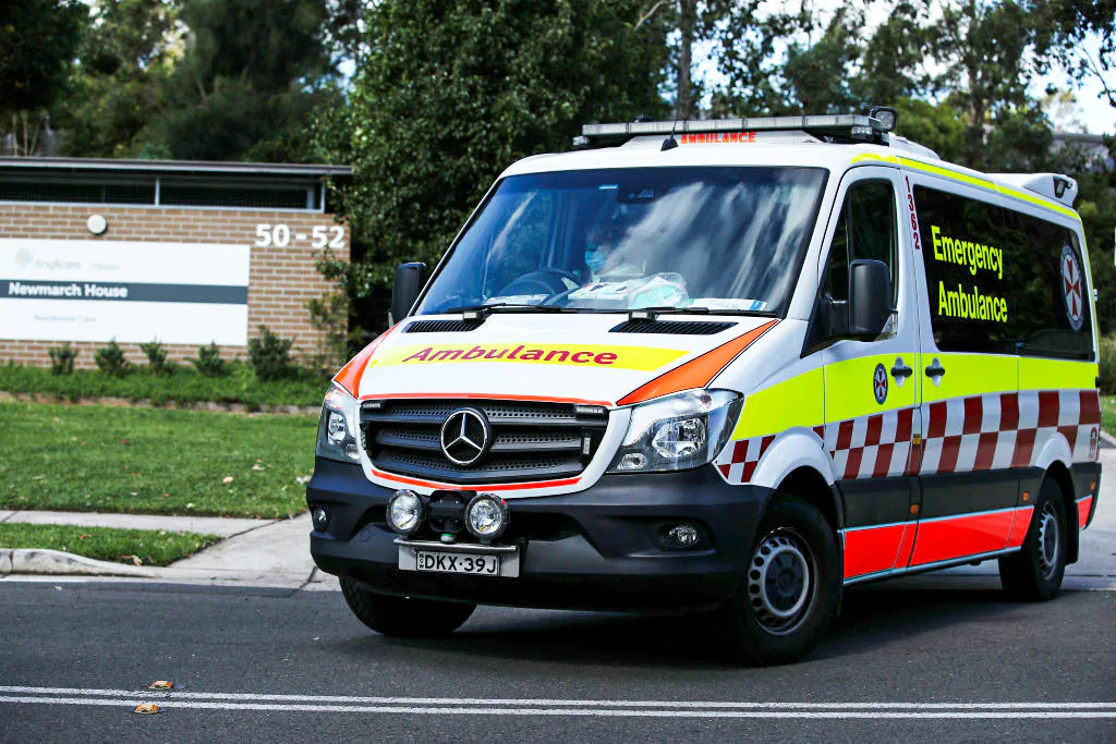 An New South Wales ambulance leaves Newmarch House with a patient on May 01, 2020 in Sydney, Australia. (Cameron Spencer/Getty Images)