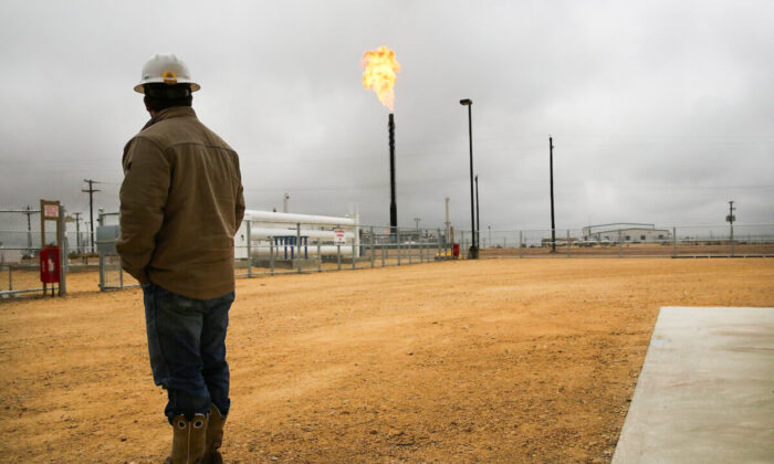 Flared natural gas is burned off at Apache Corporations operations at the Deadwood natural gas plant in the Permian Basin, Garden City, Texas, on Feb. 5, 2015. (Spencer Platt/Getty Images)