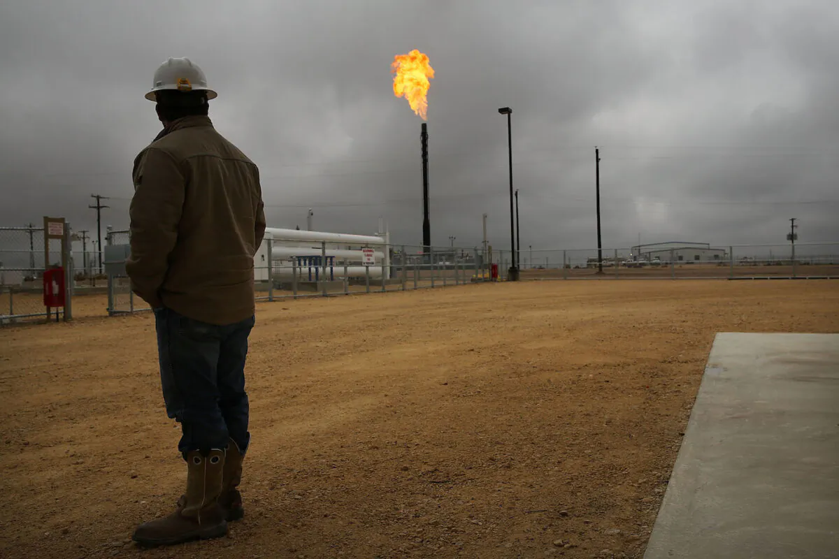 Flared natural gas is burned off at Apache Corporations operations at the Deadwood natural gas plant in the Permian Basin, Garden City, Texas on Feb. 5, 2015. (Spencer Platt/Getty Images)