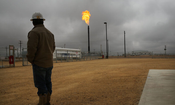 Flared natural gas is burned off at Apache Corporations operations at the Deadwood natural gas plant in the Permian Basin, Garden City, Texas on Feb. 5, 2015. (Spencer Platt/Getty Images)
