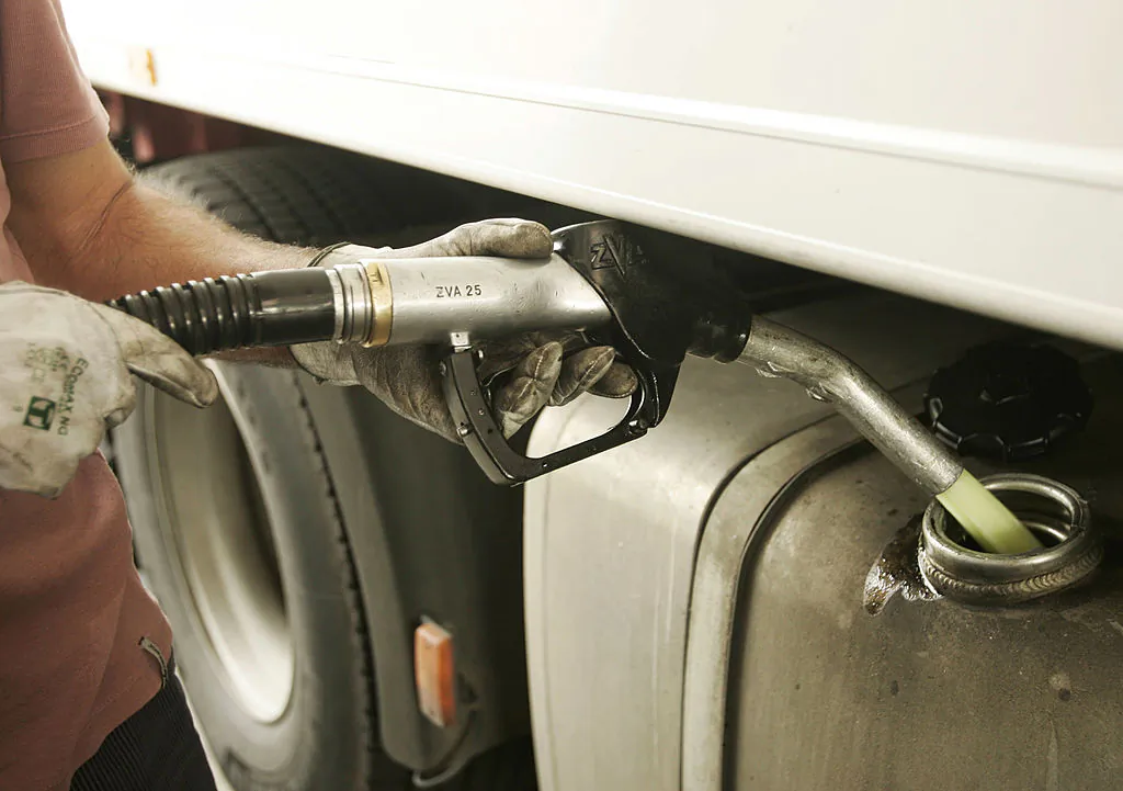 A truck driver fills up with diesel, in an undated file photograph. (Mark Renders/Getty Images)