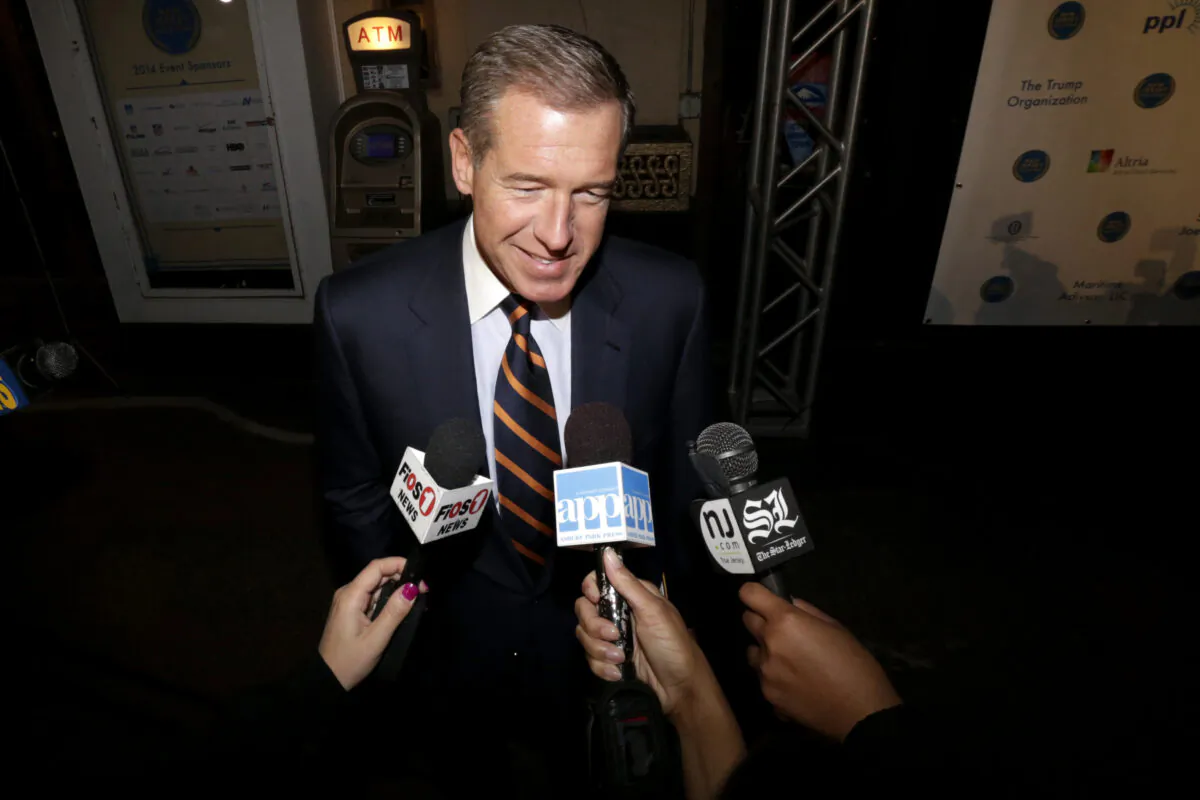 Television journalist Brian Williams arrives at the Asbury Park Convention Hall during red carpet arrivals prior to the New Jersey Hall of Fame inductions, in Asbury Park, N.J., on Nov. 13, 2014. (Julio Cortez/AP Photo)