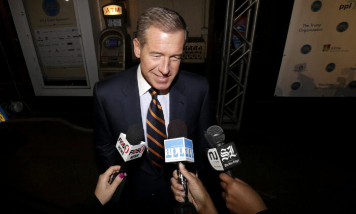 Television journalist Brian Williams arrives at the Asbury Park Convention Hall during red carpet arrivals prior to the New Jersey Hall of Fame inductions, in Asbury Park, N.J., on Nov. 13, 2014. (Julio Cortez/AP Photo)