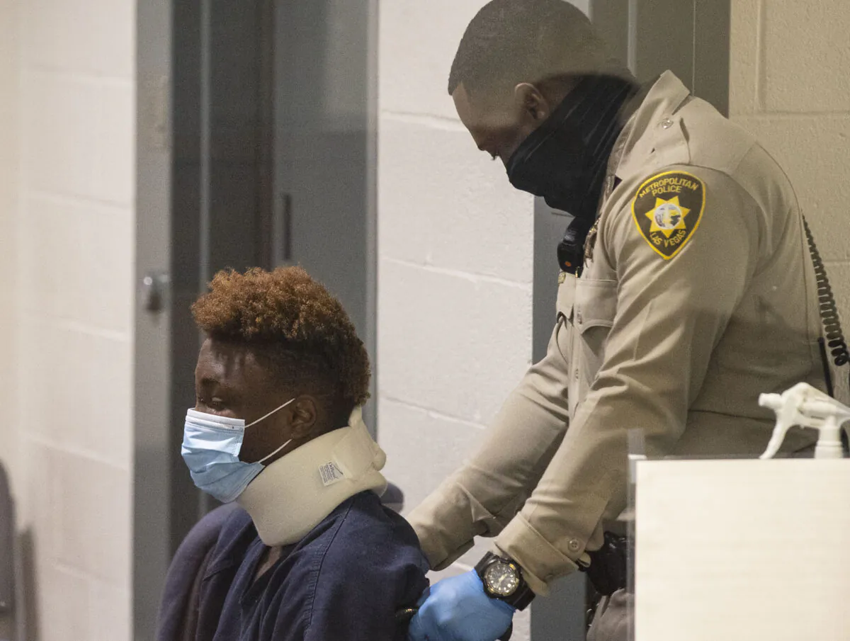 Former Raiders wide receiver Henry Ruggs, accused of DUI resulting in death, is brought into the courtroom during his initial arraignment at the Regional Justice Center in Las Vegas, on Nov. 3, 2021. (Bizuayehu Tesfaye/Las Vegas Review-Journal via AP)